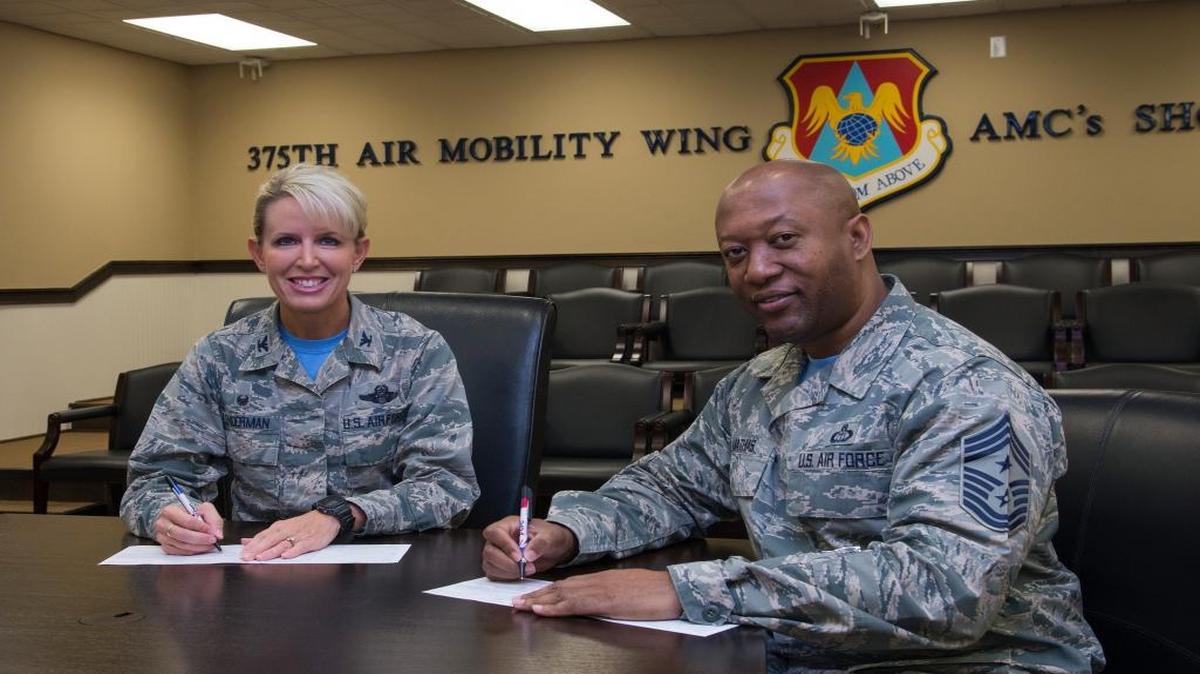 Col. Laura Lenderman, 375th Air Mobility Wing commander, and 375th AMW Command Chief Wesley Mathias kick off the 2016 Combined Federal Campaign by making personal donations. The contributions of federal, military and postal employees have generated more than $8 billion since its creation in 1964.