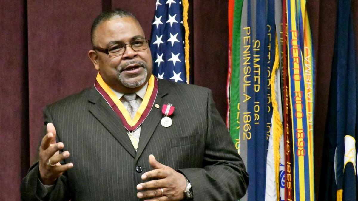 Bernard Walls, the Logistics Division chief for the Military Surface Deployment and Distribution Command, addresses attendees of his retirement ceremony.