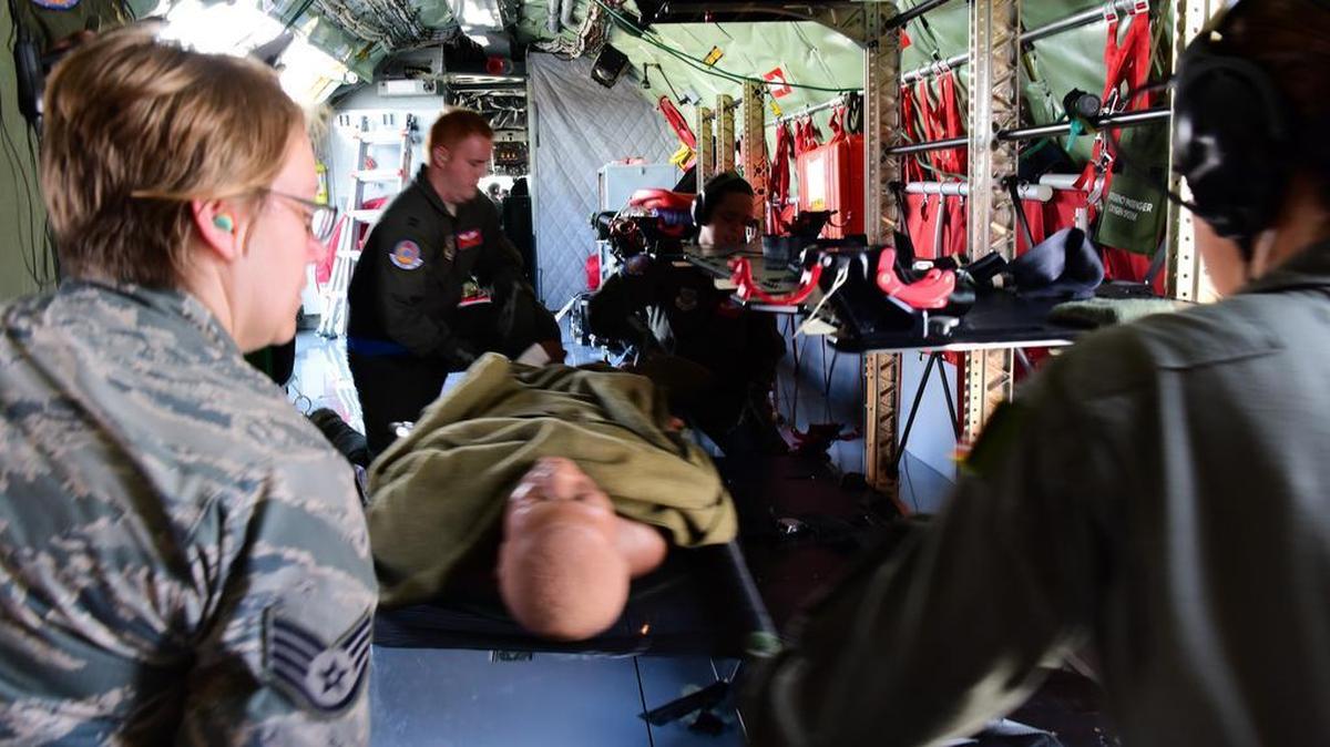 Airmen assigned to the 375th Aeromedical Evacuation Squadron load a simulated patient onto a KC-135 Stratotanker in preparation for a training mission on Scott Air Force Base. During training, squadron members practice several medical treatments to make sure simulated patients get the care they require.