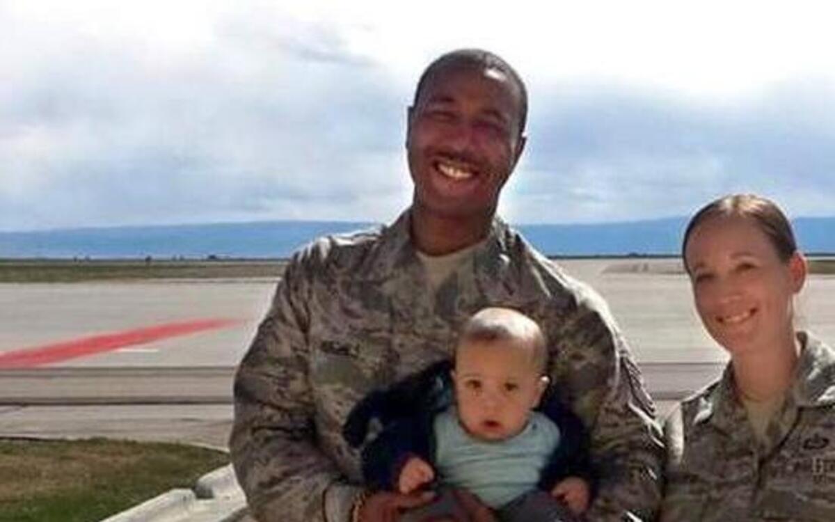 Master Sgt. Donald Hughes, Air Mobility Command, and Master Sgt. Cortny Hughes, 15th Operational Weather Squadron, with their son and daughter, Jeffrey and Keira.