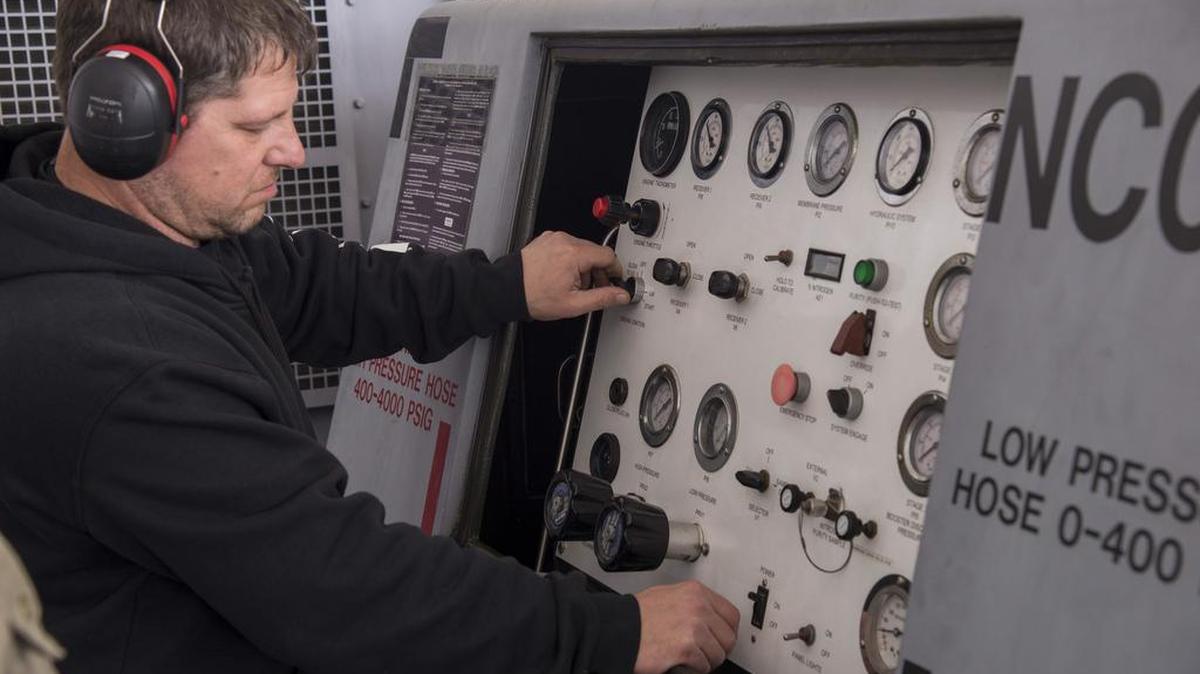 Jeff Dalton, 375th Operations Support Squadron aerospace ground equipment mechanic, performs an operational check on a self-generating nitrogen service cart. Nitrogen carts are one of the many different pieces of equipment used by AGE to help maintainers service aircraft on the flight line.
