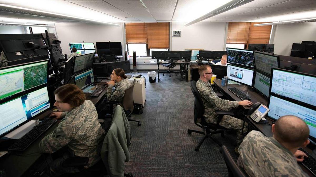 Airmen with the 15th Operational Weather Squadron work on forecasting for the Northeastern United States at Scott Air Force Base. These Airmen work with satellite imagery to determine when to send out severe weather alerts to military bases.