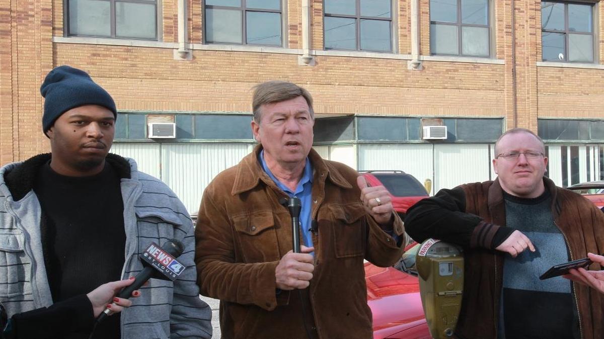 In this file photo, the Rev. Larry Rice (center) is joined by Kevin Peals (left) and Bryan Anderson, both of Belleville, outside the former YMCA building in downtown Belleville on November 15, 2012.