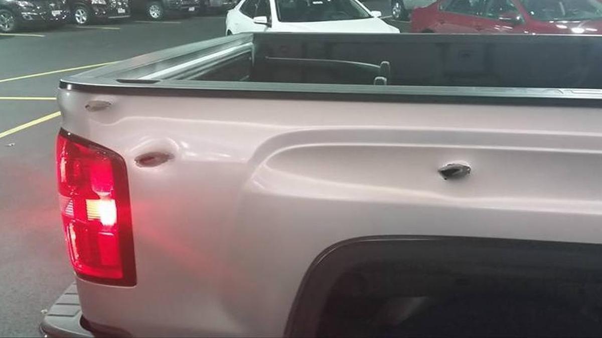 Bullet holes riddle the side of Jason Tabscott’s truck. After the truck was stolen Sept. 19, it was repainted silver. Police found the truck in St. Louis in October.