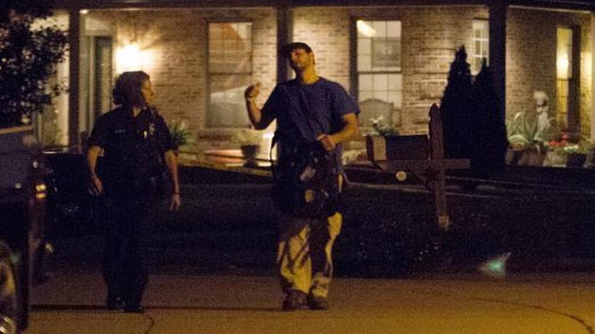 
Investigators at the scene of a shooting that left one dead and another seriously injured in the 900 block of High Ridge in Columbia on Monday evening.
