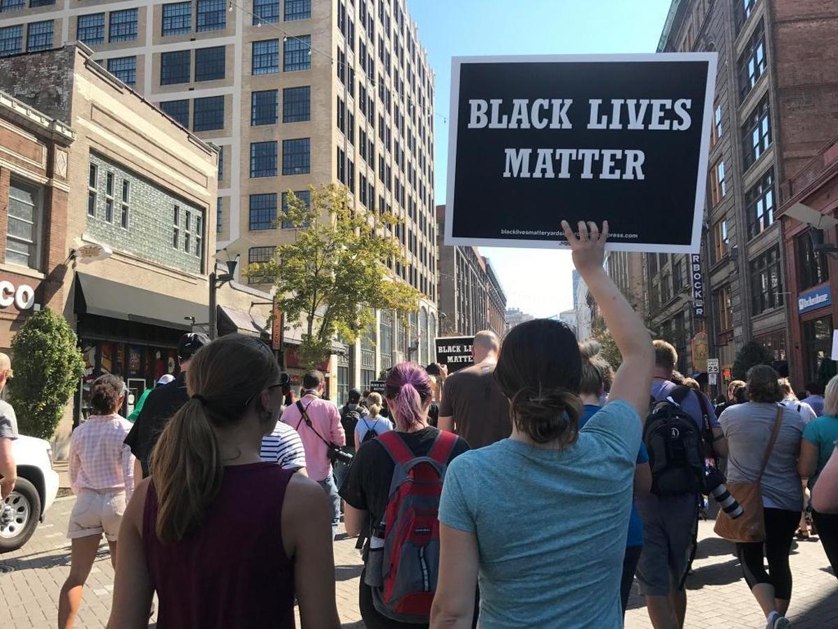 Protesters make their way down Washington Avenue Friday morning.