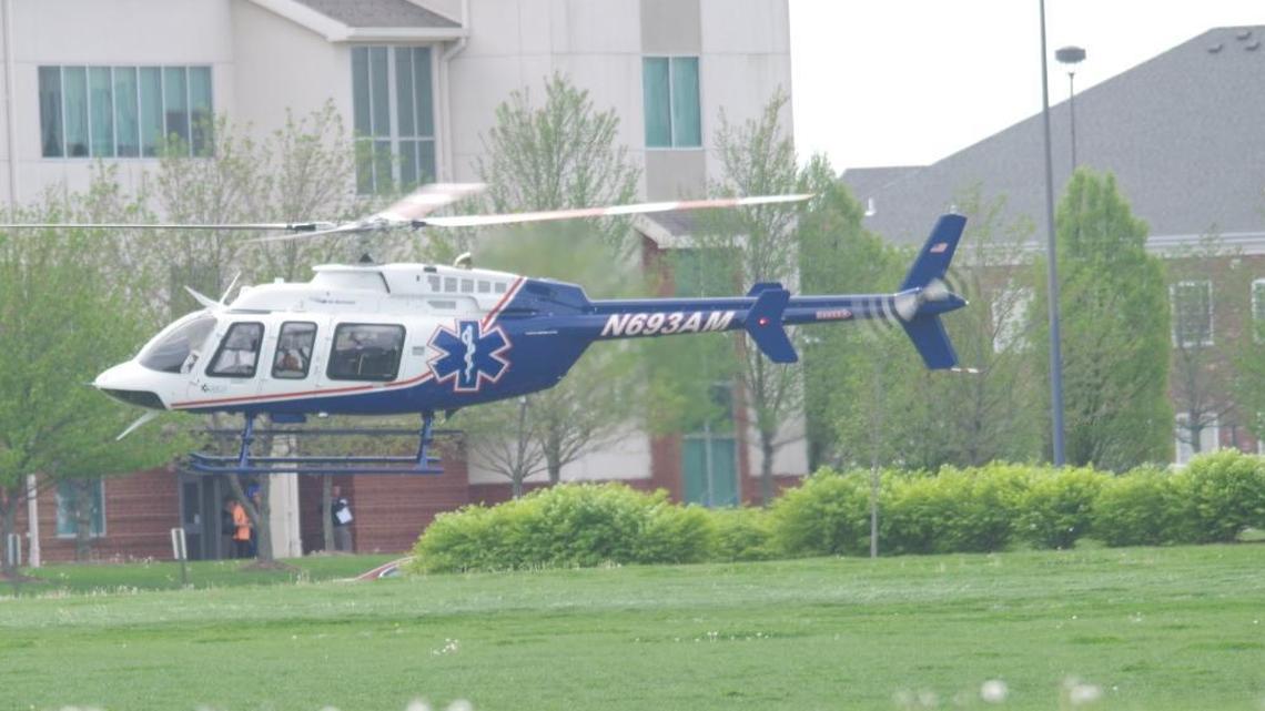 A helicopter carried an SIUE woman to a St. Louis hospital after she was struck by a car at Edwardsville High School, where she is a volunteer track coach, on Monday.