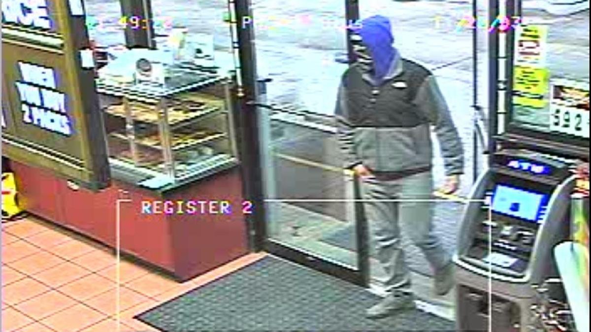 Surveillance image of the suspect in a robber at a Collinsville gas station.