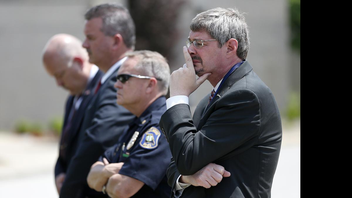 
Hazelwood’s city manager, at right, and other members of the Major Case Squad outside the Hazelwood Police Department Wednesday during the press conference for the homicide of SIUE student Taylor Clark.
