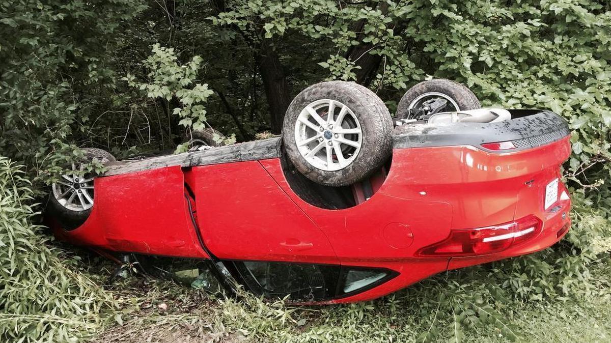 
A vehicle with New Hampshire plates overturned on Hartman Lane Wednesday afternoon and traveled down a large embankment, coming to rest on its roof near the treeline. 
