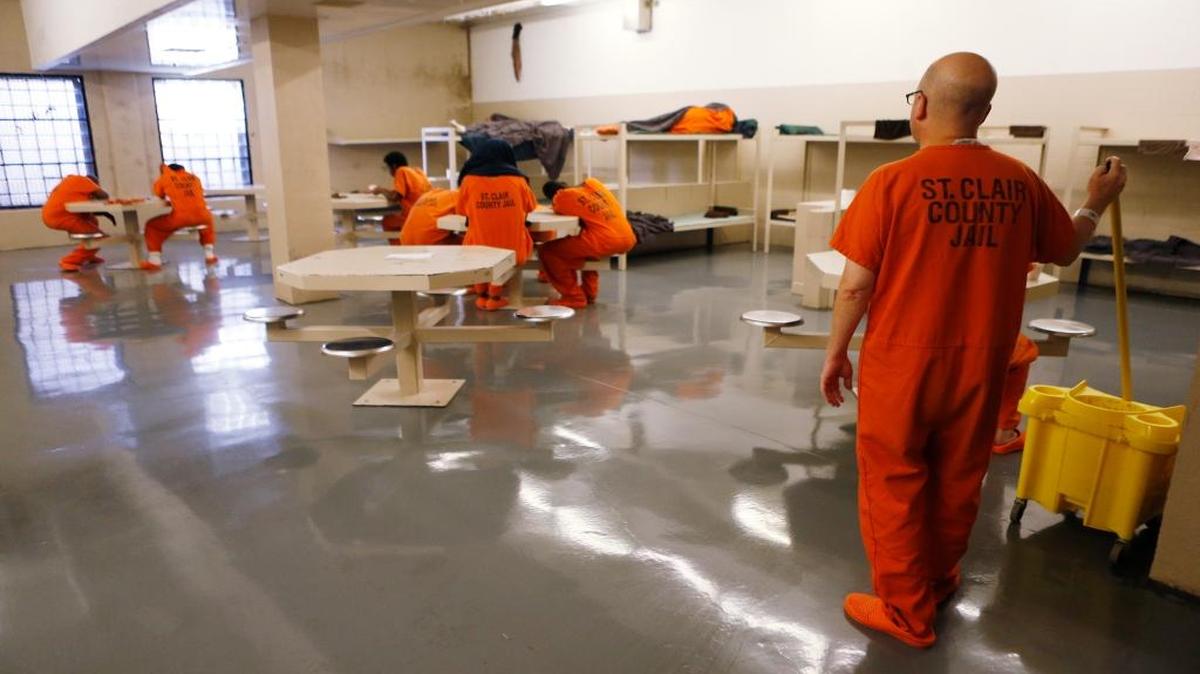 Prisoners spend time inside the day-room of the St. Clair County Jail in Belleville on Wednesday afternoon. The jail avoids overcrowding through use of their “cop-out" program. “Every Thursday we have ‘cop-out Thursday’ and we release the non-violent offenders to try to get our number down below that 418 mark, but get prepared for the weekend.” Said St. Clair County Sheriff Rick Watson. “Over the weekend a lot of things happen and our population could go over that 418 mark, so we try to keep it down so we don’t get sued for people sleeping on the floor or any of the other sanitary issues.”