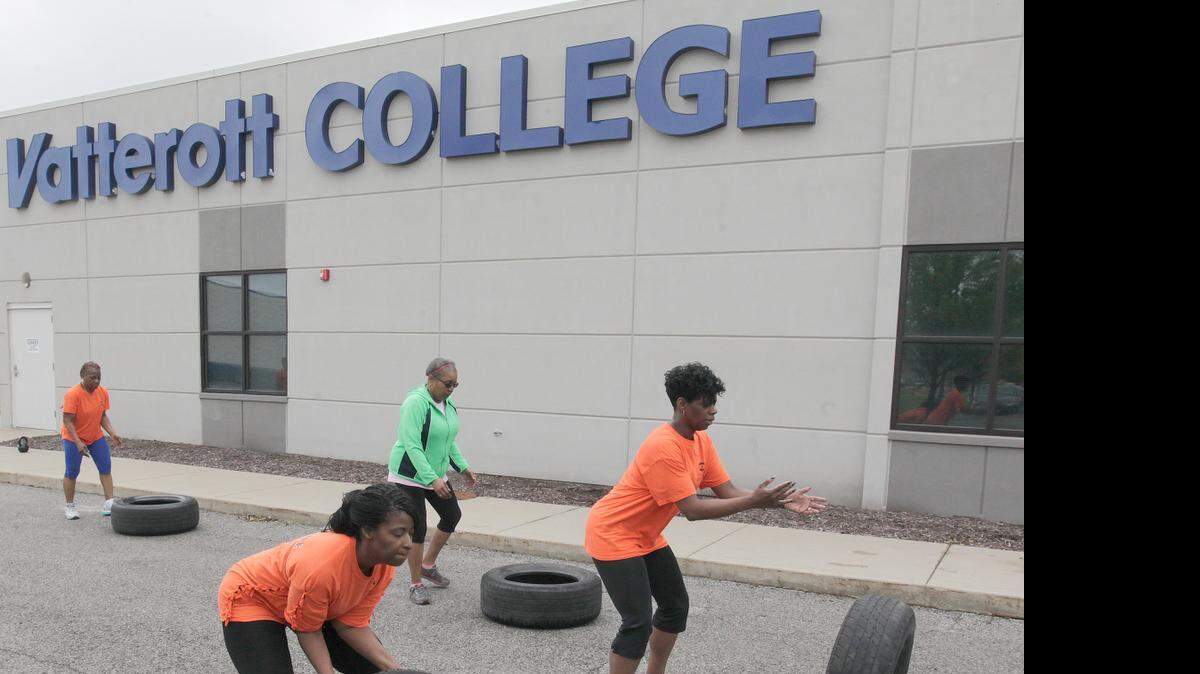 
Vatterott College in Fairview Heights held a Fun Run event on Saturday, which involved running, pushups, tire flipping, and other physical fitness exercises. Here, participants complete in tire flipping, moving the tires down the side of the building, one flip at a time. 
