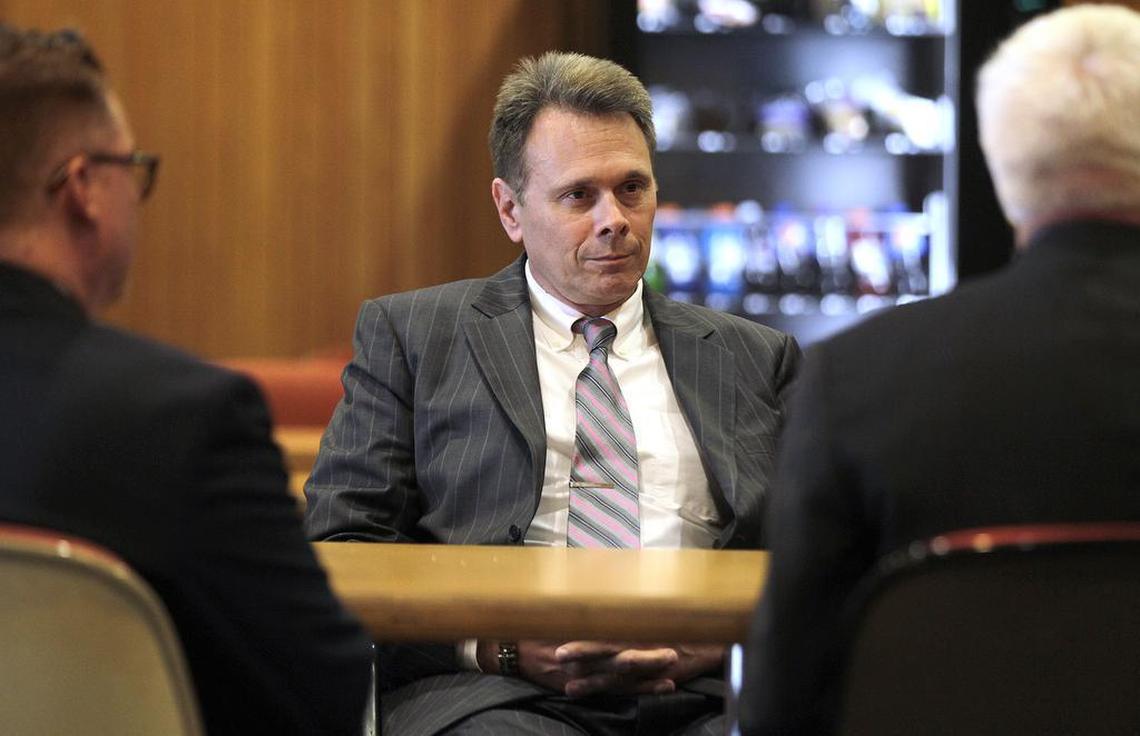 St. Clair County Judge Ron Duebbert (center) meets with David Robinson, deputy director of the Illinois Special Prosecutor’s Office (left) and Special Prosecutor Dave Neal in the cafeteria on the fifth floor of the St. Clair County building before he was called in to testify before the grand jury on Friday morning. He was in and out of the grand jury room in about five minutes.