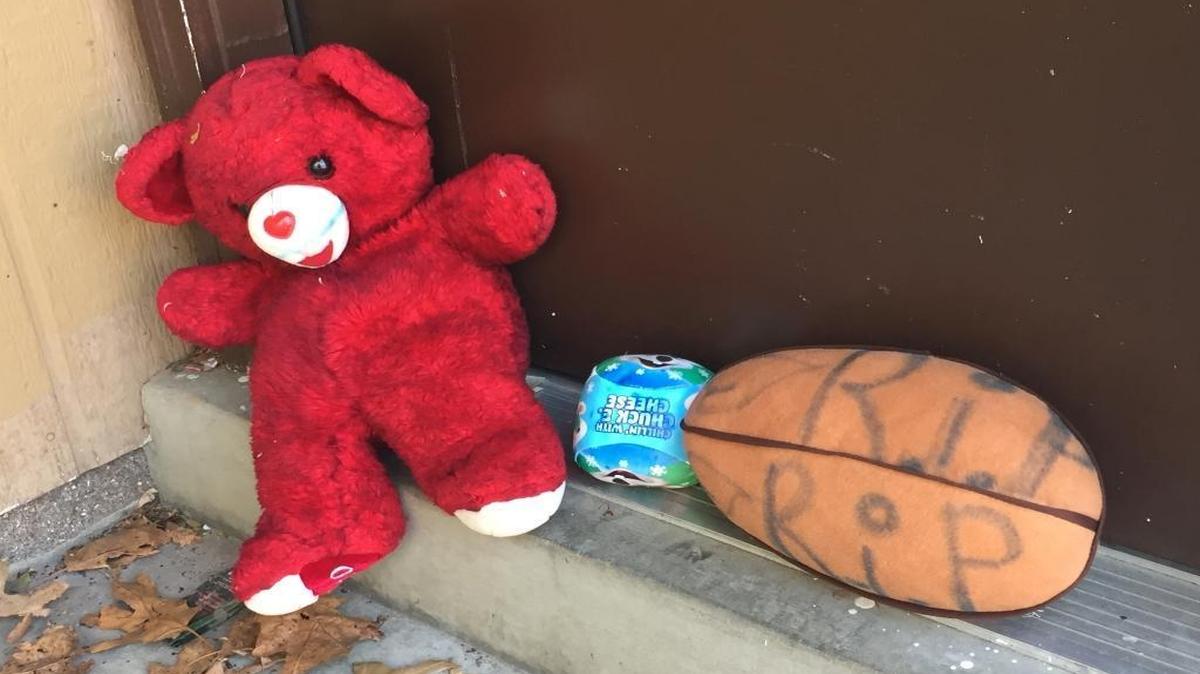 Some toys were at the doorstep of the child’s apartment on Saturday.