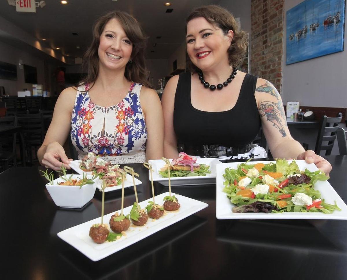 Amanda Schlecht (left) and Stephanie Gain are the co-owners of Seven in downtown Belleville.
