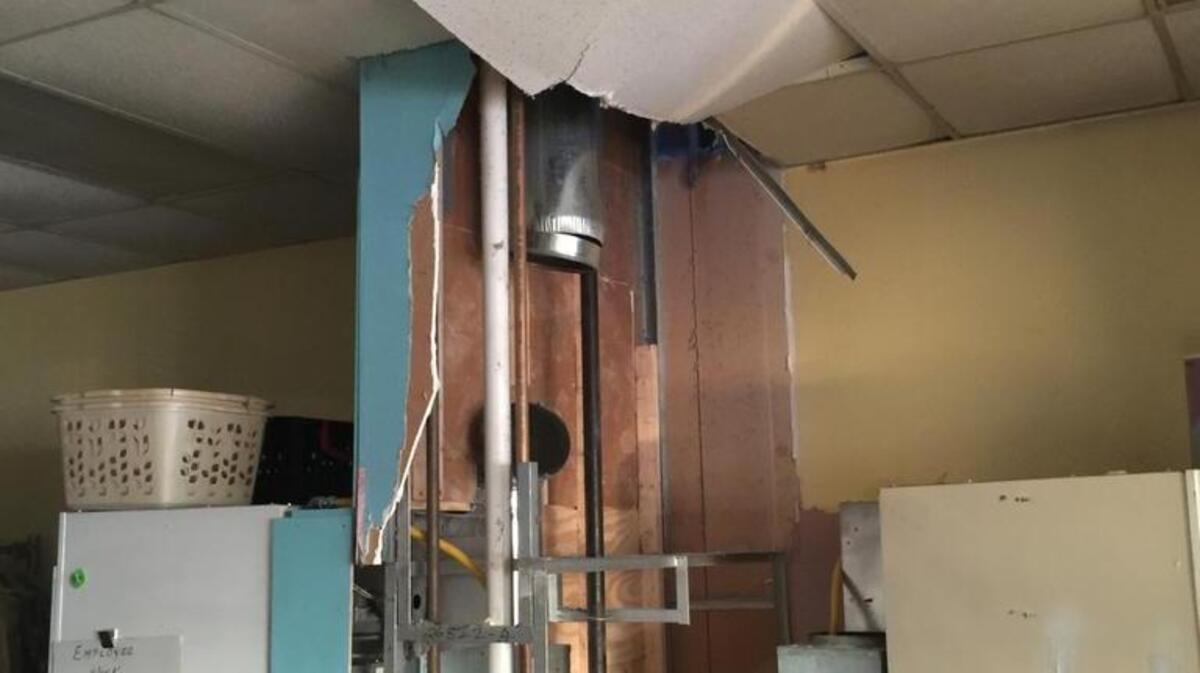 Firefighters needed to tear out part of the ceiling and walls inside Lakeland Square Laundry Friday afternoon before they could put out a fire that started inside the business at 4555 N. Illinois St. in Swansea.
