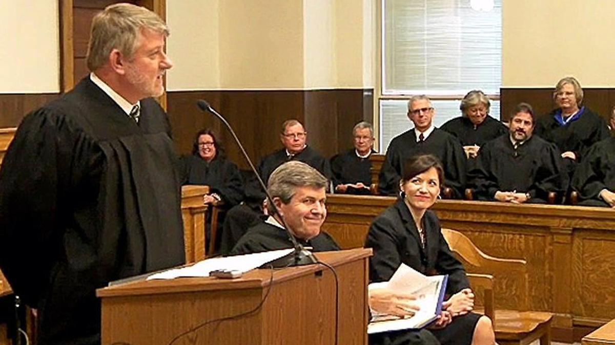 Judge Michael McHaney, left, speaks at a swearing-in ceremony for judges in 2010.