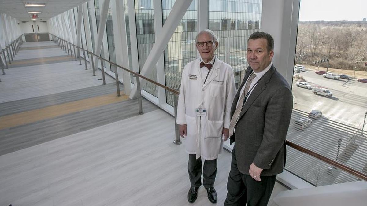 Dr. Sessions Cole, chief medical officer for St. Louis Children’s Hospital, and Dr. George Macones, Barnes-Jewish Hospital chief of obstetrics and gynecology, stand on the 110-foot-long skywalk that connects the Women and Infants Center with neonatal intensive care.