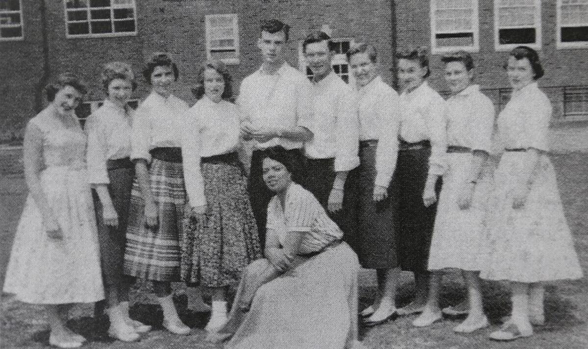 Johnetta Haley, bottom center, poses with music students at Nipher Junior High School in Kirkwood, Missouri. She was one of four black teachers.