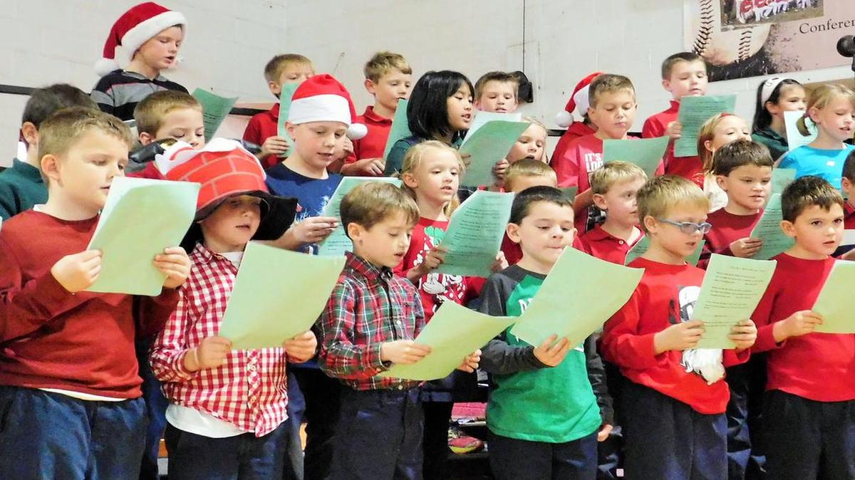 The first and second-graders sing Christmas carols at the Saints Peter and Paul Catholic School concert in December.