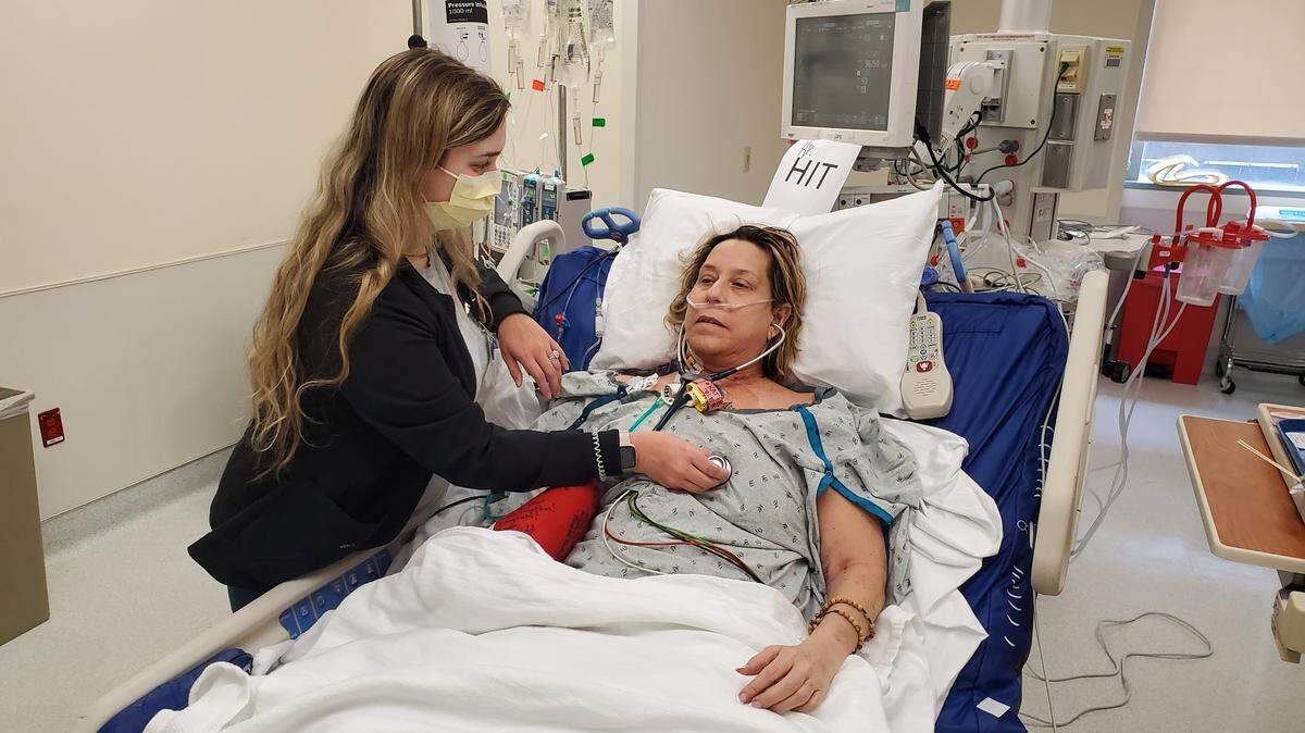 O’Fallon High School Superintendent Darcy Benway listens to her new heart for the first time after having a heart transplant in May 2021. She named her new heart “Tank.” 