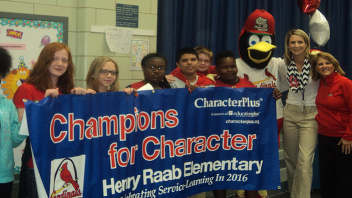 Fred Bird of the St. Louis Cardinals helped Henry Raab Elementary during its recognition assembly for achieving Champions of Character.