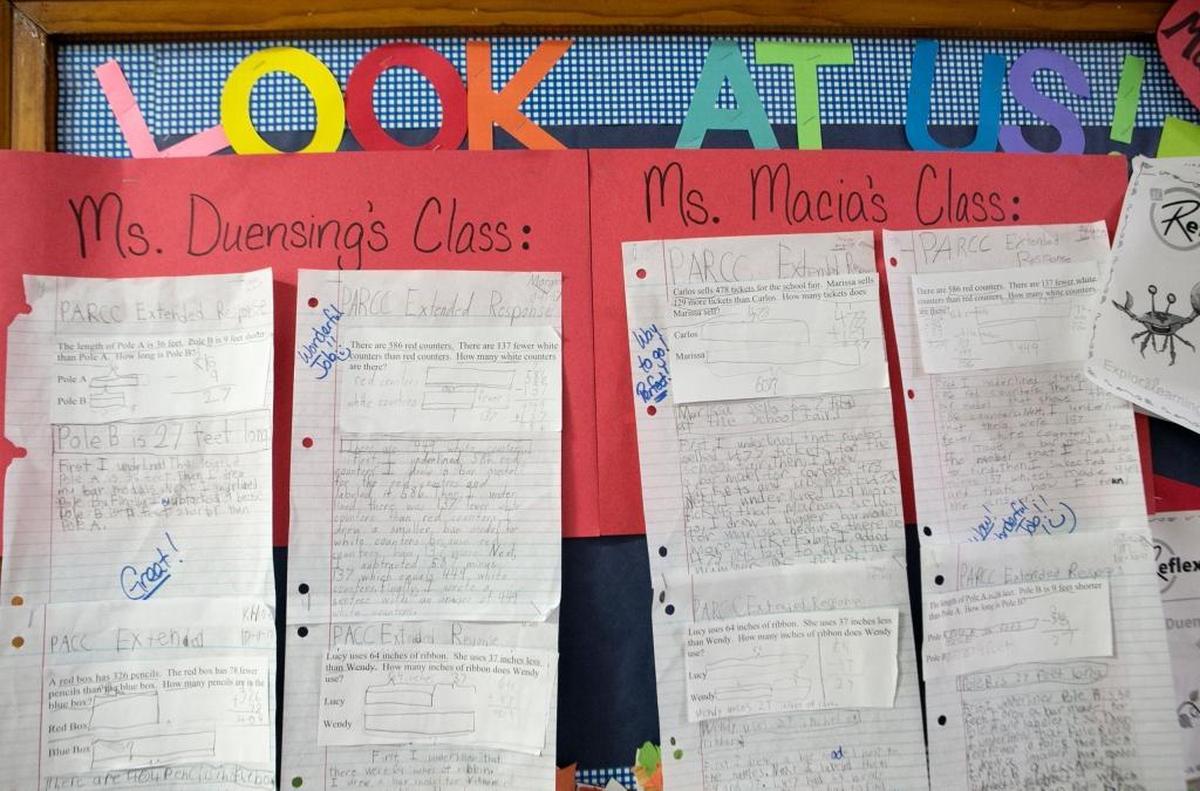 Examples of New Athens third-graders’ PARCC practice work is on display in the school hallway.