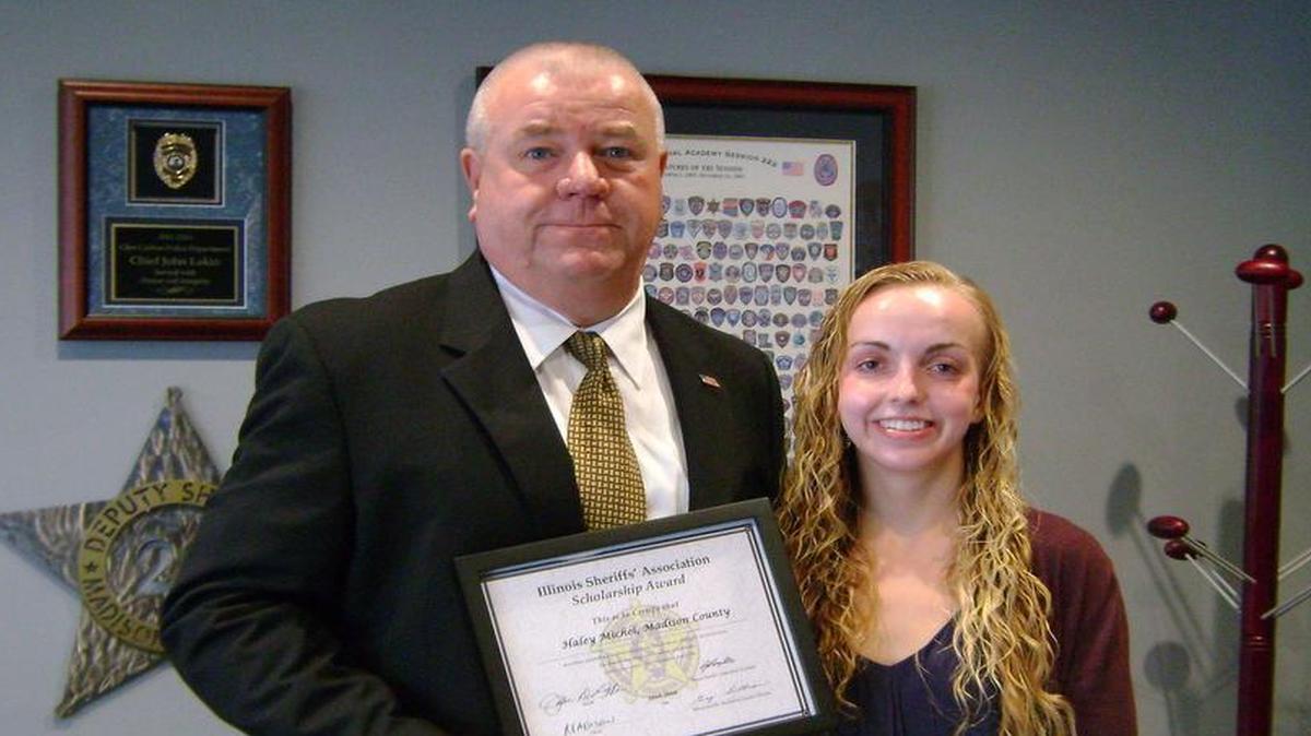 
Sheriff John D. Lakin and scholarship winner Haley Michel, of Civic Memorial High School in Bethalto.
