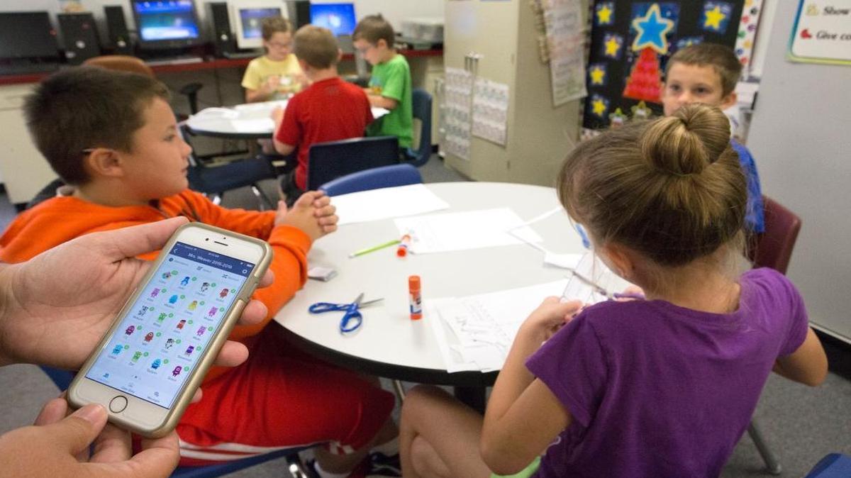 
Millstadt Community Consolidated School teacher Shannon Weaver uses the classroom dojo application while her third grade class works on a project. Wevaer and parents can access the application from their personal computers or through a phone application.
