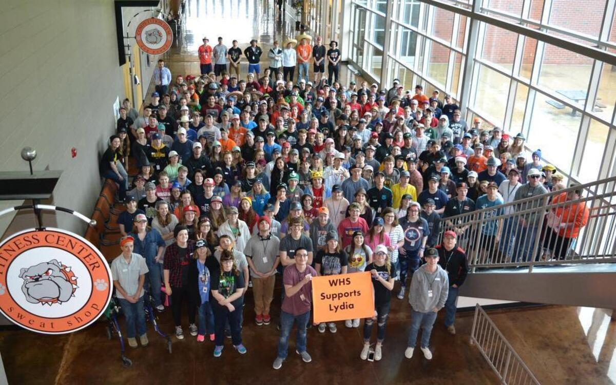 Waterloo High School students pose for a photograph with a sign that reads “WHS Supports Lydia.” Lydia Boyer is a 6-year-old girl in Monroe County who has stage four brain cancer. Students and families in Waterloo District 5 recently raised almost $7,000 to help the Boyer family cover Lydia’s medical expenses.
