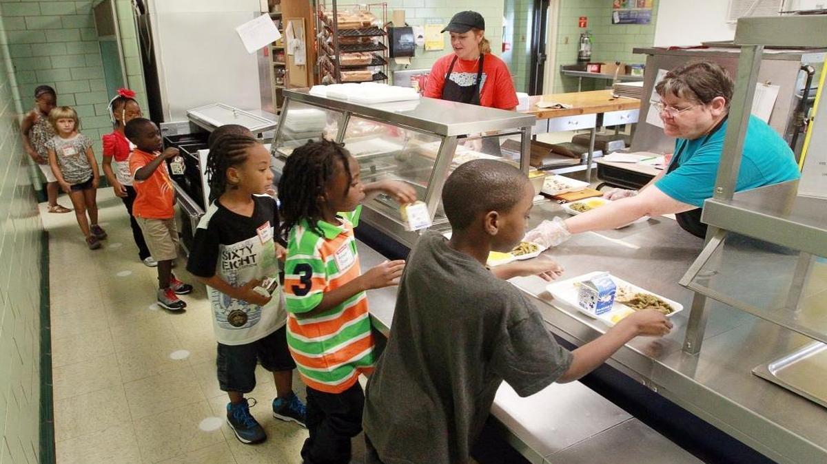 In this 2014 file photo, first grade students at Union Elementary School in Belleville District 118 line up for lunch.