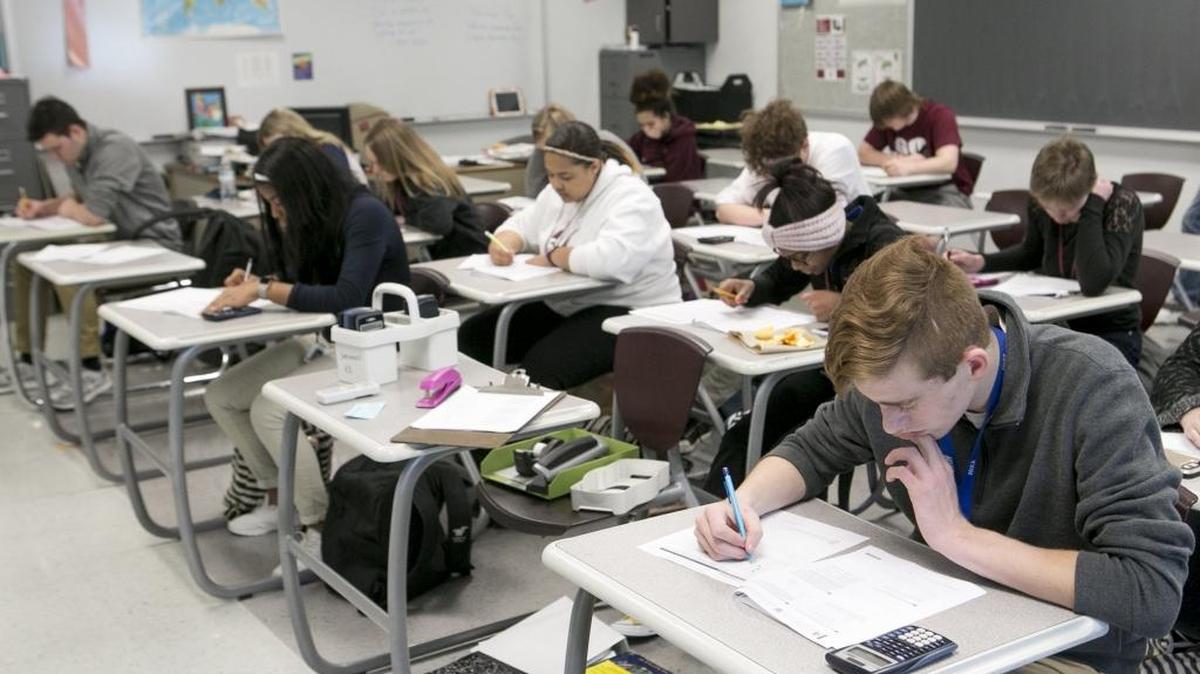 Belleville West High School juniors work on a practice SAT test ahead of the first administration of the exam as the state’s new assessment in April 2017.