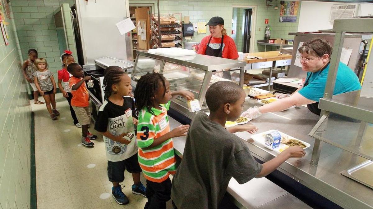 In this file photo, Union Elementary School food service staff serve a group of first-grade students.