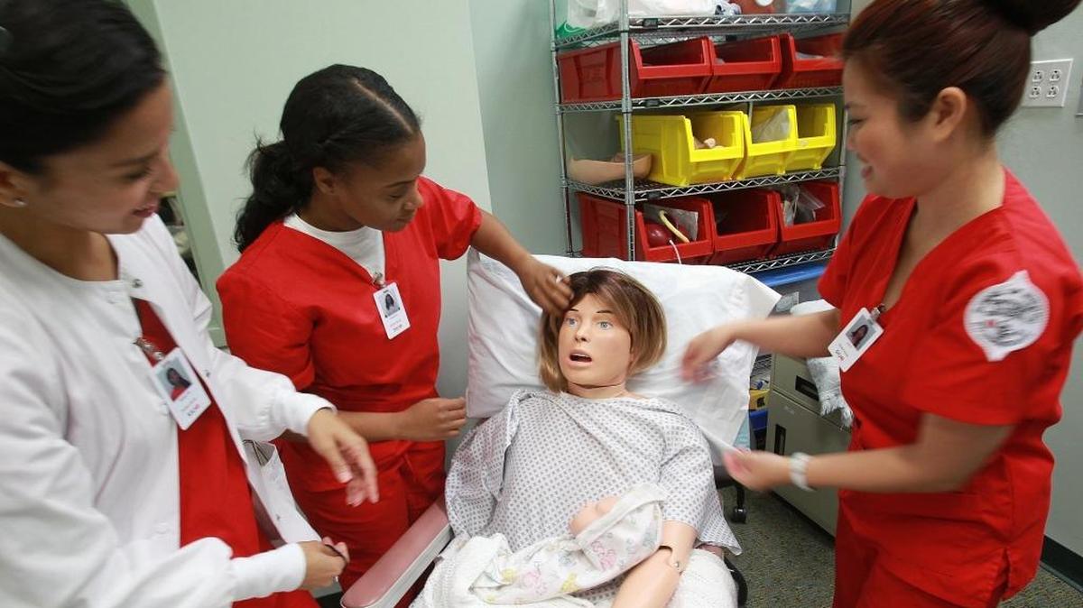 Southern Illinois University Edwardsville nursing students study with a simulator in the Simulate Learning Center for Health Sciences at the SIUE School of Nursing.