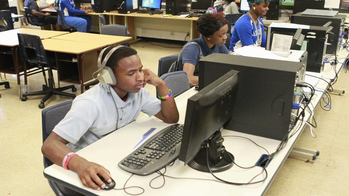 In this 2014 file photo, Lovejoy Technology Academy students work on world history and language arts assignments. The school is one of three in Brooklyn District 188, which will have a new superintendent starting in July 2017.