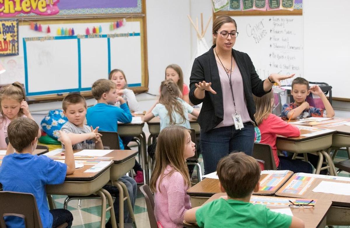 New Athens third grade English language arts teacher Elena Macia works on Venn diagrams with students. Over three years of PARCC testing, New Athens Elementary is one of the most improved schools.