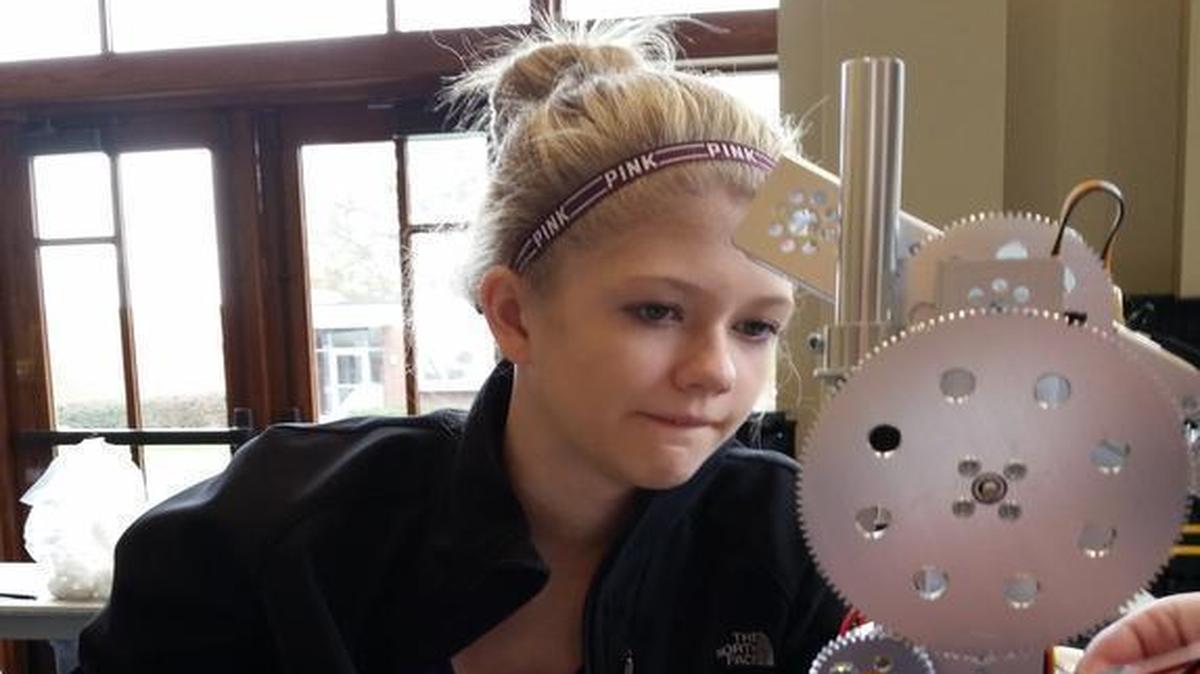
Katie Buchanan, of O’Fallon, studying wiring on her robotic team’s robot.
