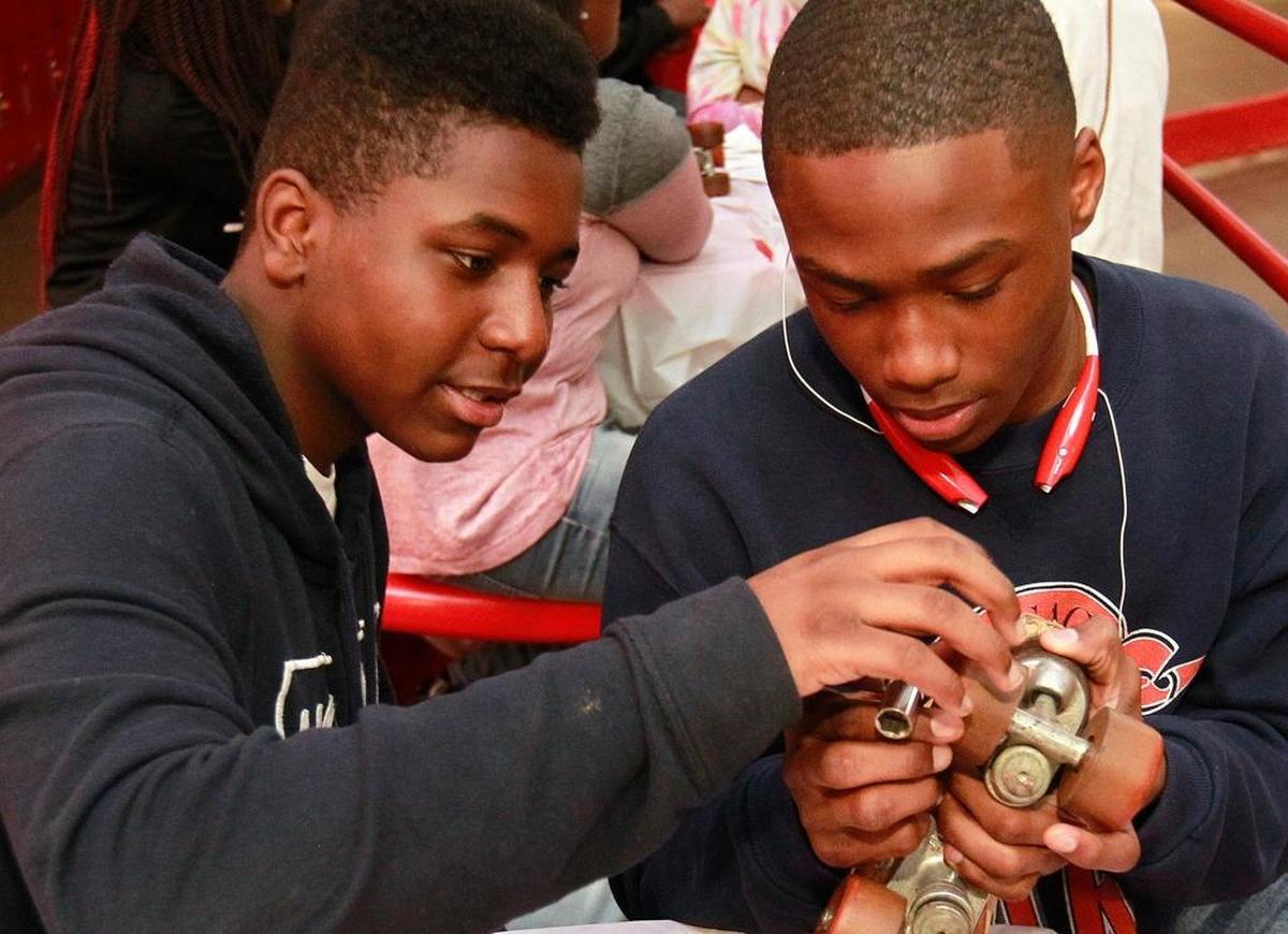Students from 8th Grade Academy in Cahokia District 187 learned about various sciences while at a special rollerskating class at Skate City in East St. Louis in spring 2017. The students heard about the history of roller skating, the laws of physics that come into play while skating, and here, learned the various parts of roller skates and how to disassemble and re-assemble them. The middle school students were in sixth through eighth grades.
