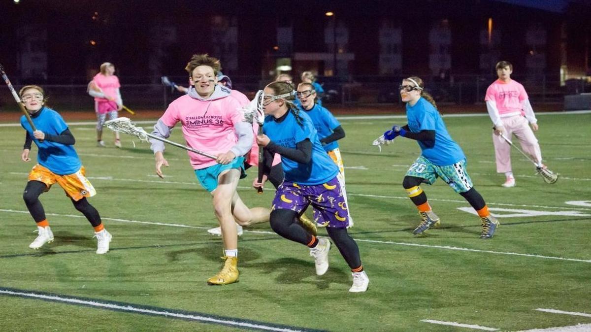 Members of the O’Fallon Township High School boys and girls lacrosse teams play a charity game to raise money for St. Jude’s Children’s Research Hospital in 2016. This year’s charity game is scheduled for Saturday, April 22.