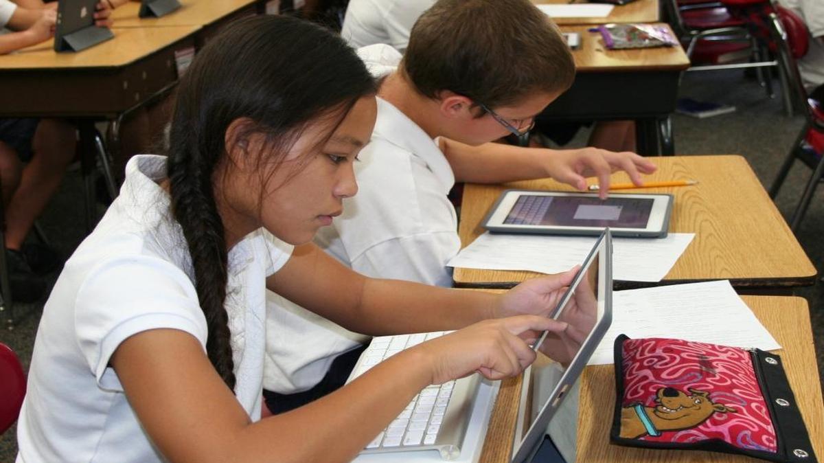 Students work on their iPads at Blessed Sacrament School in Belleville.