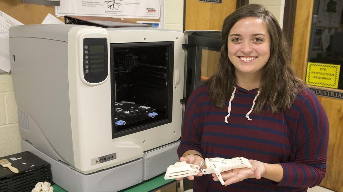 Red Bud High School student Kara Puntriano has initiated a program combining the school’s vocational classes and science classes developing prosthetic hands with the 3D printer.