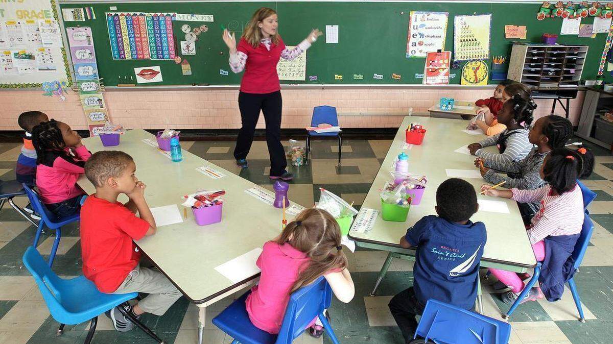 
The Legacy Christian School in Caseyville will run year-round beginnng on June 1. Markie Rincker (center of room) is the kindergarten teacher. Here, the students were practicing writing the letters of their names. 
