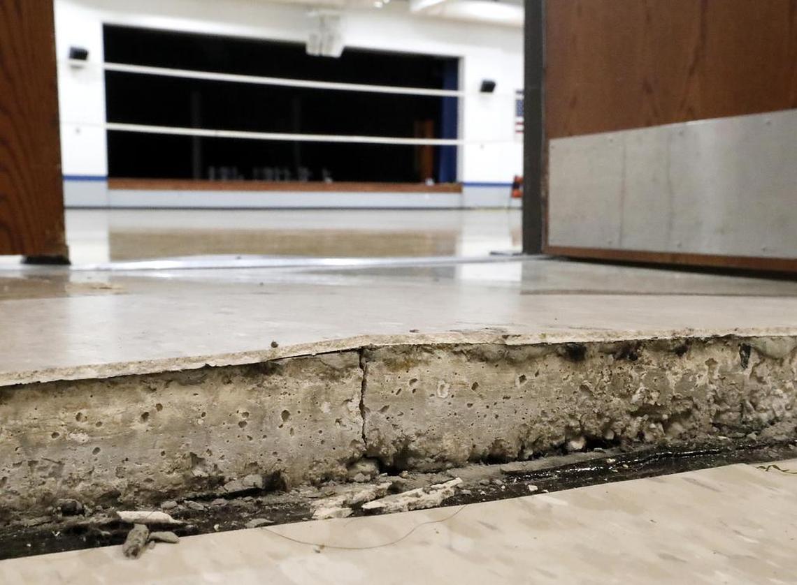 A crack measuring two inches high and several feet wide is at the entrance to the gymnasium and auditorium Monday at Wolf Branch Middle School in Swansea.