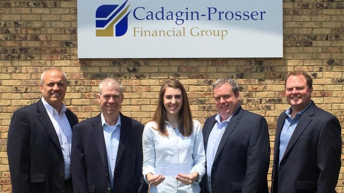 Jeff Prosser, left, Tim Cadagin, Nickie Cashdollar, Kevin Cadagin, and Greg Wiegers pose when Nickie is awarded a $1000 scholarship from Cadigin-Prosser Financial Group.