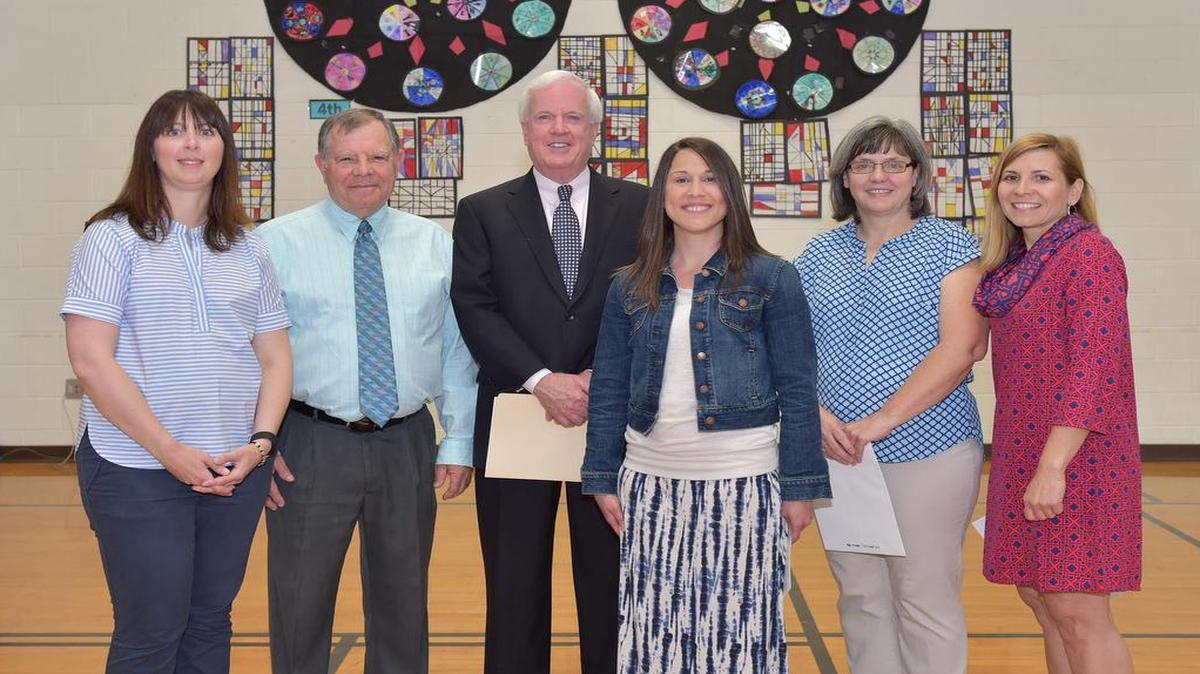 Immaculate Conception School, in Columbia, won the Emerson Gold Star Teamwork award, a total of $15,000. At the presentation were award winner Tiffany Taylor, left, ICS Principal Mike Kish, Patrick Sy, vice president of Emerson, and grant team members Angela Ettling, Karen Weiler and Cyra Herrmann.