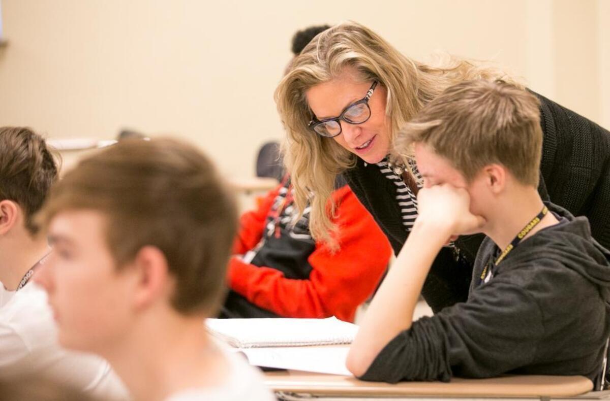 Substitute teacher Kim Atkins checks with students in an eighth-grade math class at Carriel Junior High School in O’Fallon to see if they need any help.