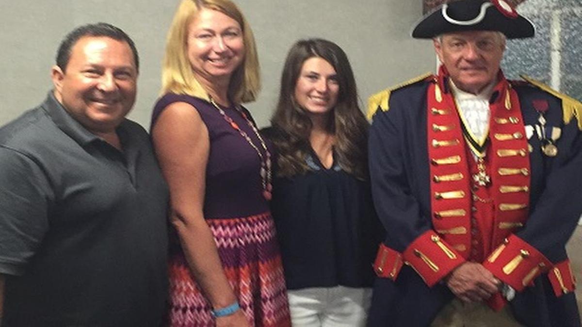 Mike, Dawn and Emily Gastro with Dan Crafton president of the Lewis & Clark SAR Chapter. Emily won a scholarship from the group.
