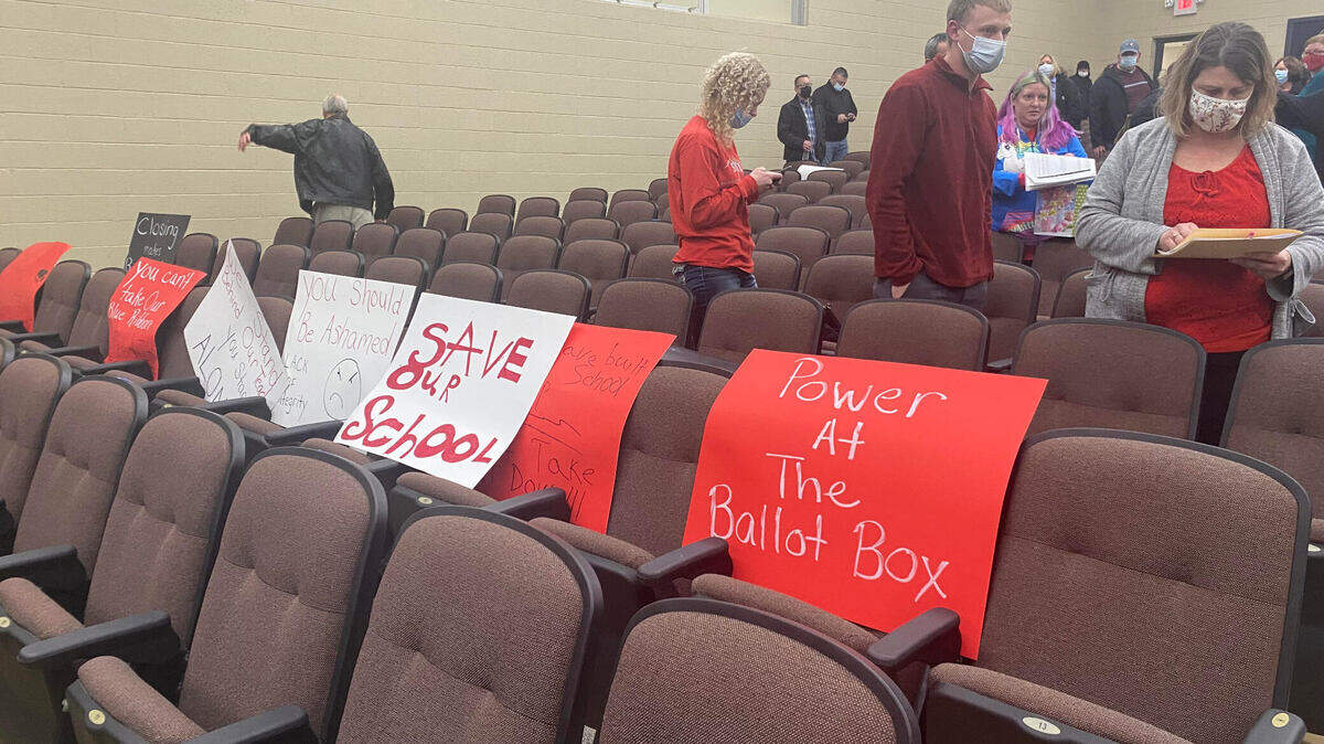 Sorento School students left their signs in the Bond County High School auditorium after the board of education voted to close Sorento at the end of the school year on Wednesday night.
