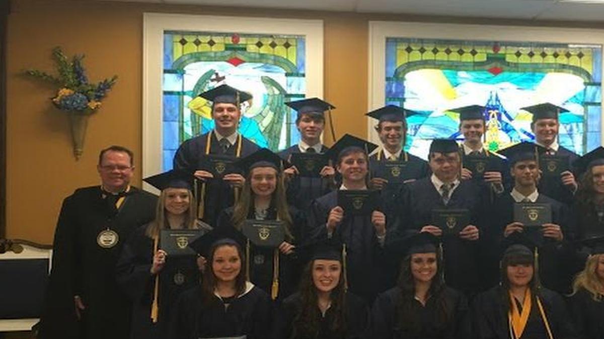 Father McGivney Catholic graduated 17 students in its first high school class.
