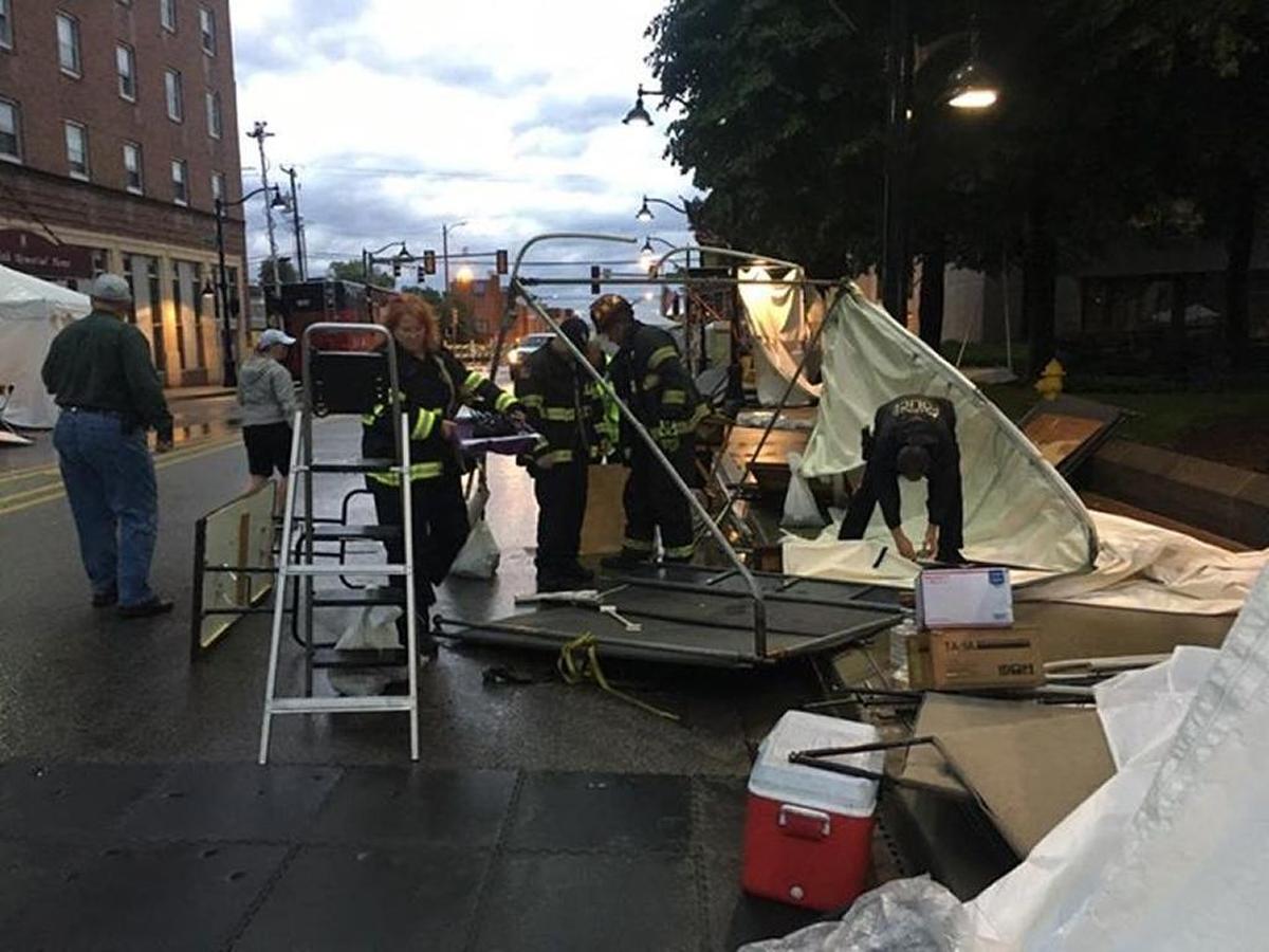 Belleville firefighters lend a hand after winds caused damage Friday morning at Art on The Square.